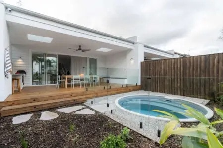Guests relaxing by the pool and garden at Rubus Residences, Berry NSW, luxury accommodation by Travellarks Getaways